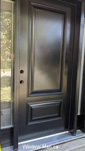Black door. Solid core door.  Executive panels. Sidelights acid glass